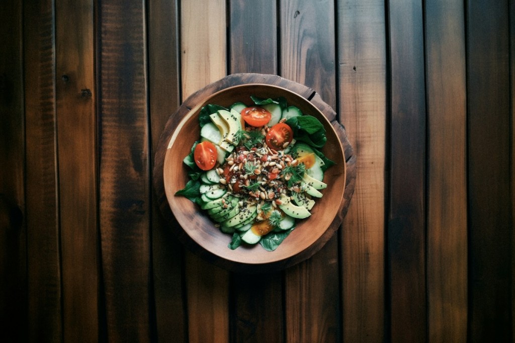 Healthy looking salad served in a wooden bowl