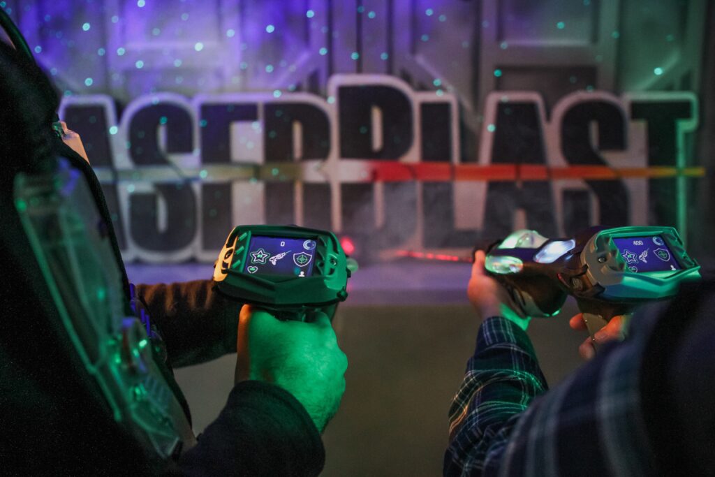 Players Holding Laser Guns at LaserBlast which could be great fun to introduce as an activity at an event