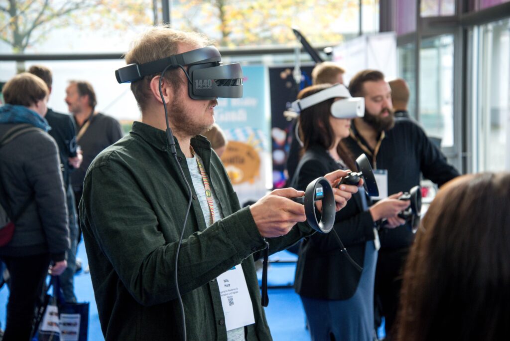 People at an event doing virtual reality activity