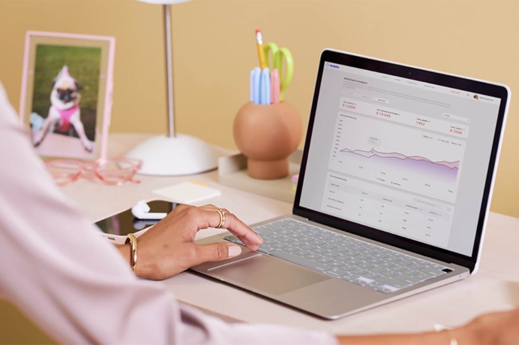 An event planner analyzes event data on a computer screen.