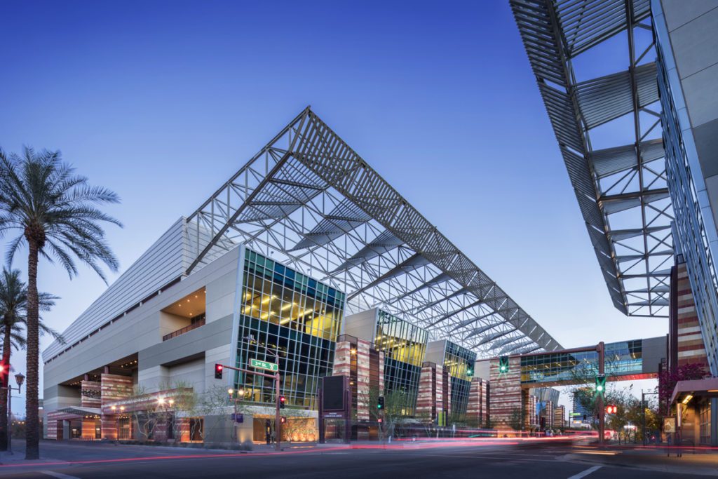An evening exterior shot of the Phoenix Convention Center.