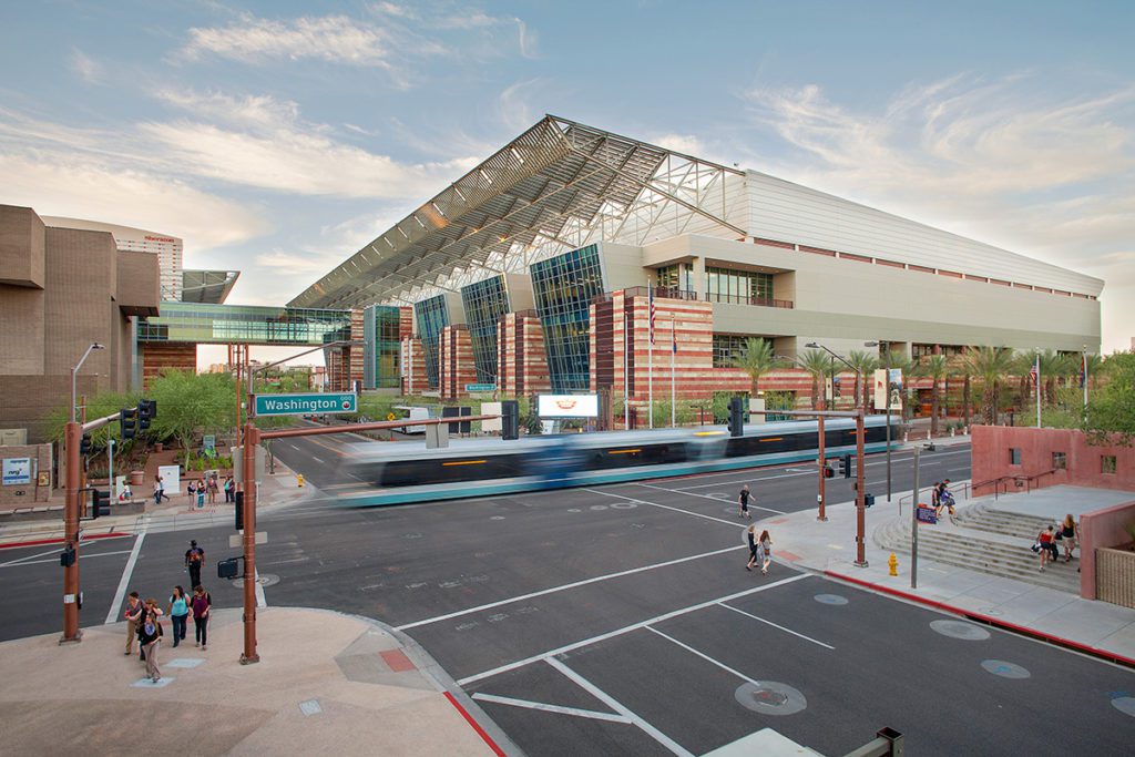 A computer-generated image of a Valley Metro Rail train car passing by the Phoenix Convention Center.