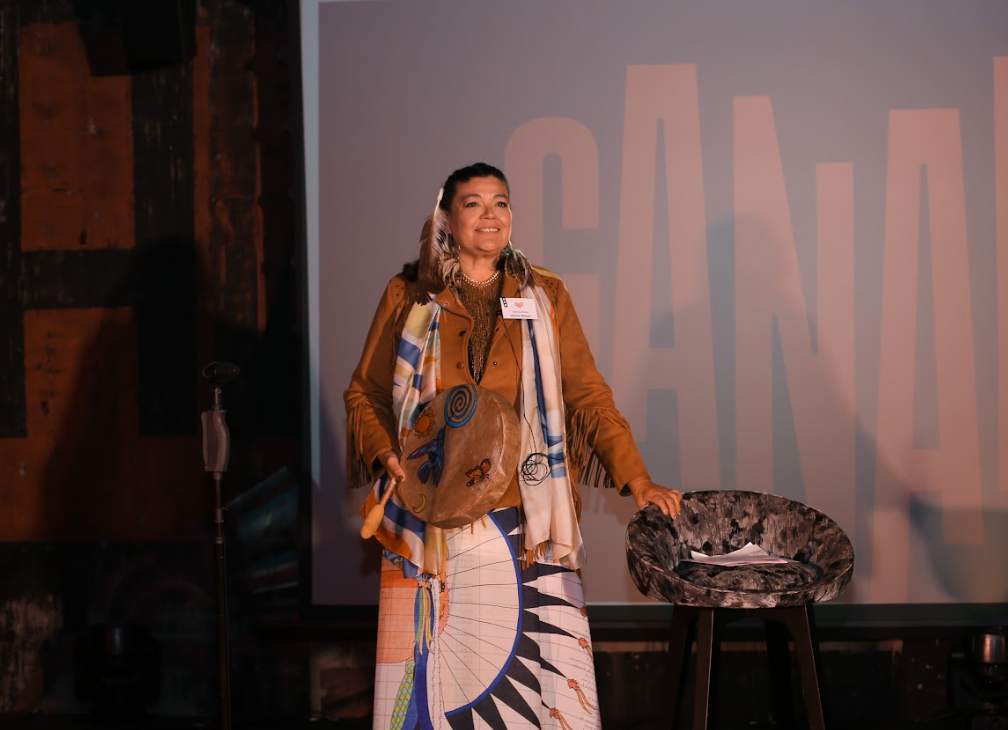 Indigenous Canadian plays the drum