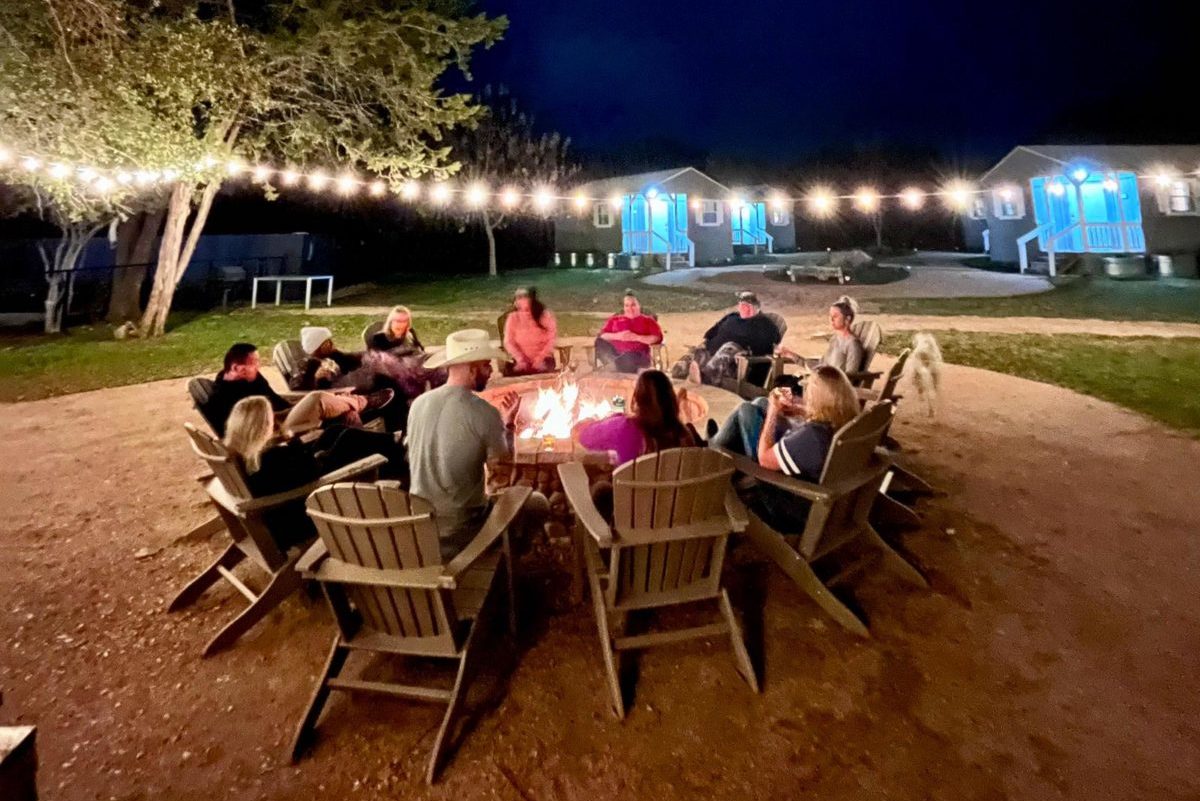 Group sitting around a fire pit.