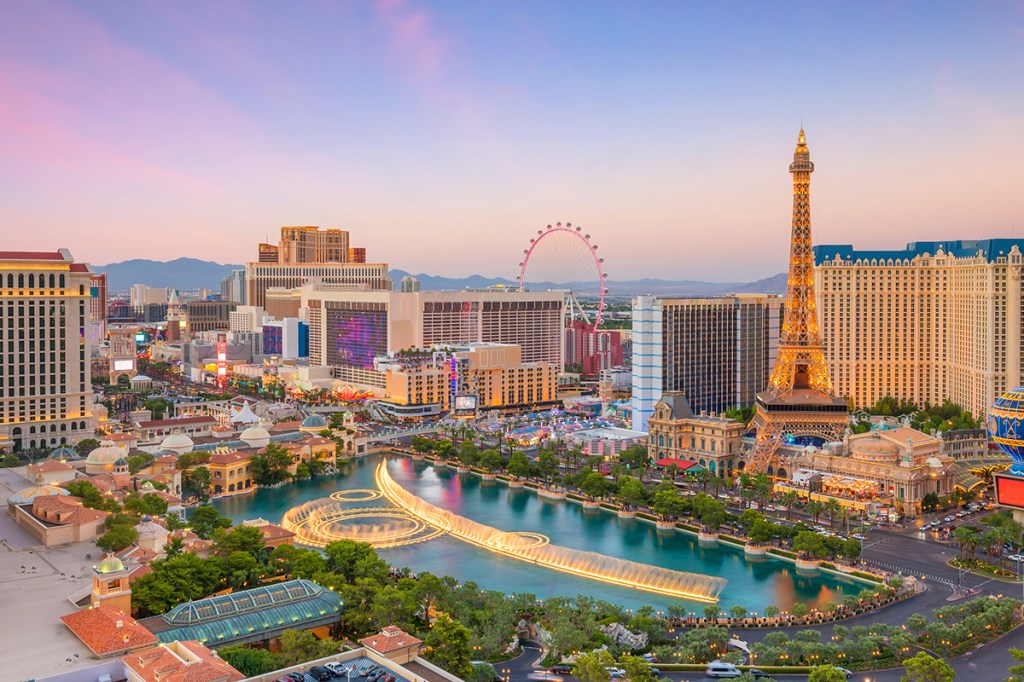 The High Roller wheel visible in the Las Vegas skyline at sunset.