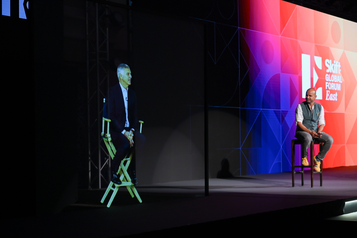 Hilton CEO Chris Nassetta beams in as a hologram to fireside chat with Skift CEO Rafat