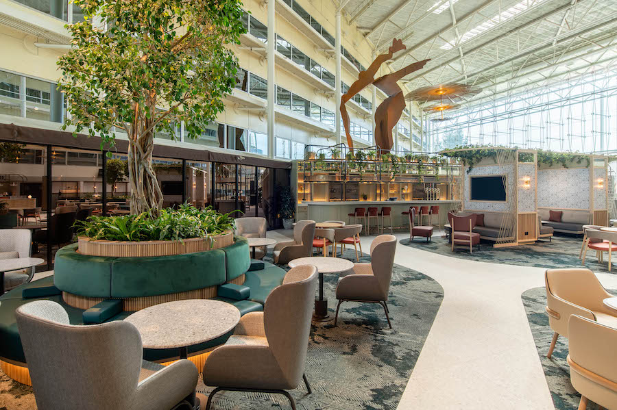 An open-concept meeting space that is sectioned off into mini seating areas for maximum collaboration at Hilton London Heathrow.