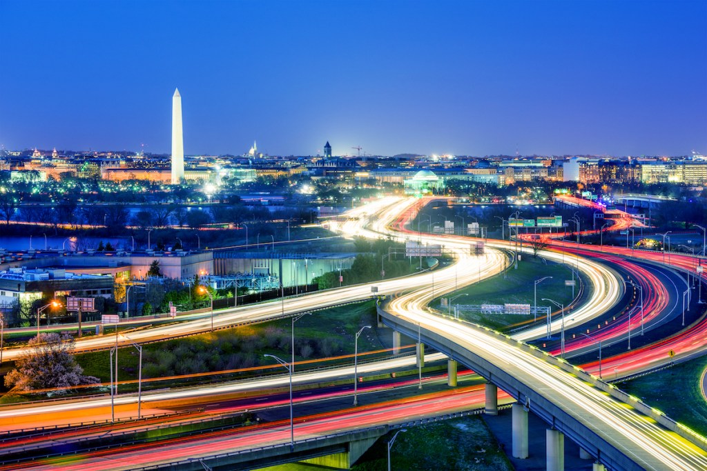 An image of several intersecting highways in downtown Washington, DC at night.