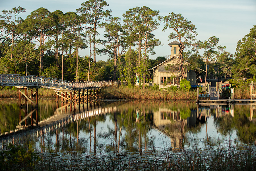A lakeside view of WaterColor BoatHouse, a rustic cottage-style venue with classic Florida charm — the perfect venue for an intimate bleisure event.