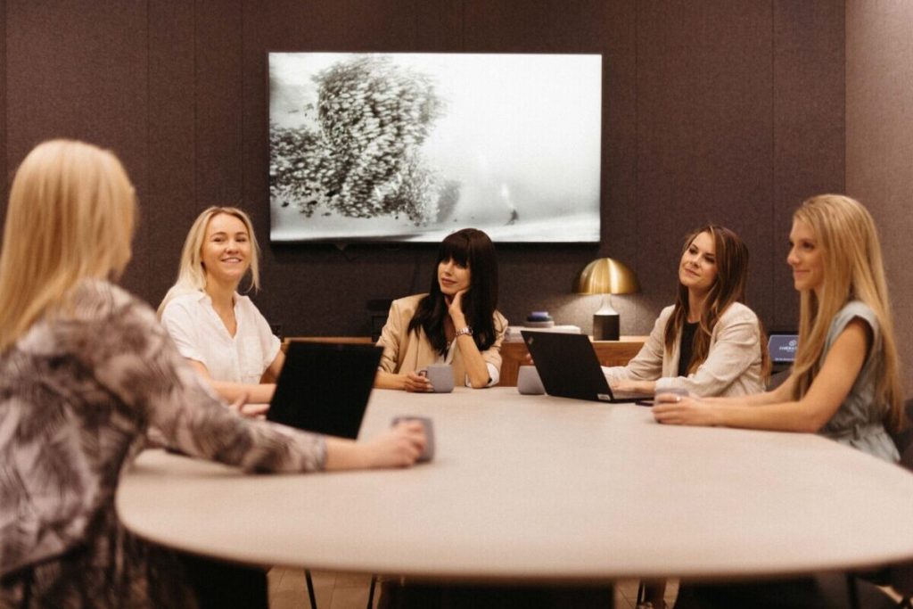 People sitting around a meeting table