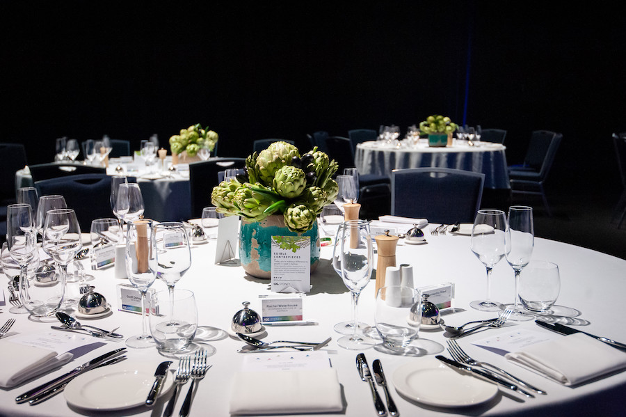 A bouquet of artichokes forms the centerpiece of a dinner table at an event, an option under ICC Sydney's Legacy Program designed for event changemakers who want to embrace a holistic approach to sustainability.
