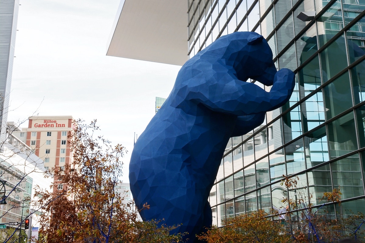 Iconic Blue Bear Statue Looking Into the Colorado Convention Center in Denver.