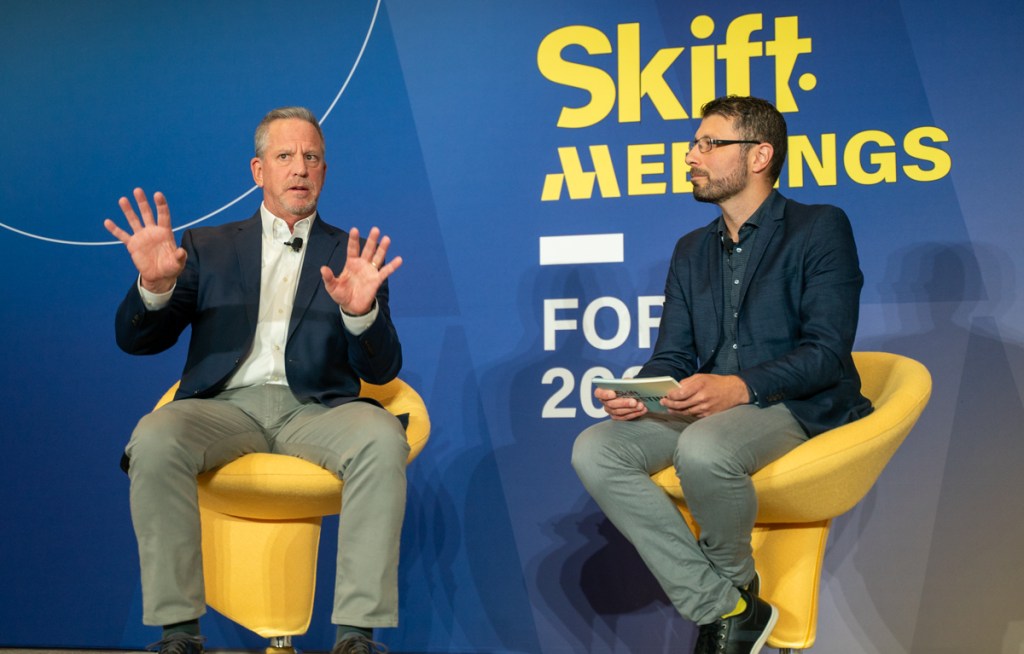 David Peckinpaugh on stage at Skift Meetings Forum 2023 interviewed by Skift Meetings Editor-in-Chief Miguel Neves