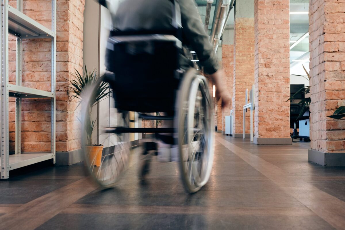 Person Using Wheelchair in a office environment