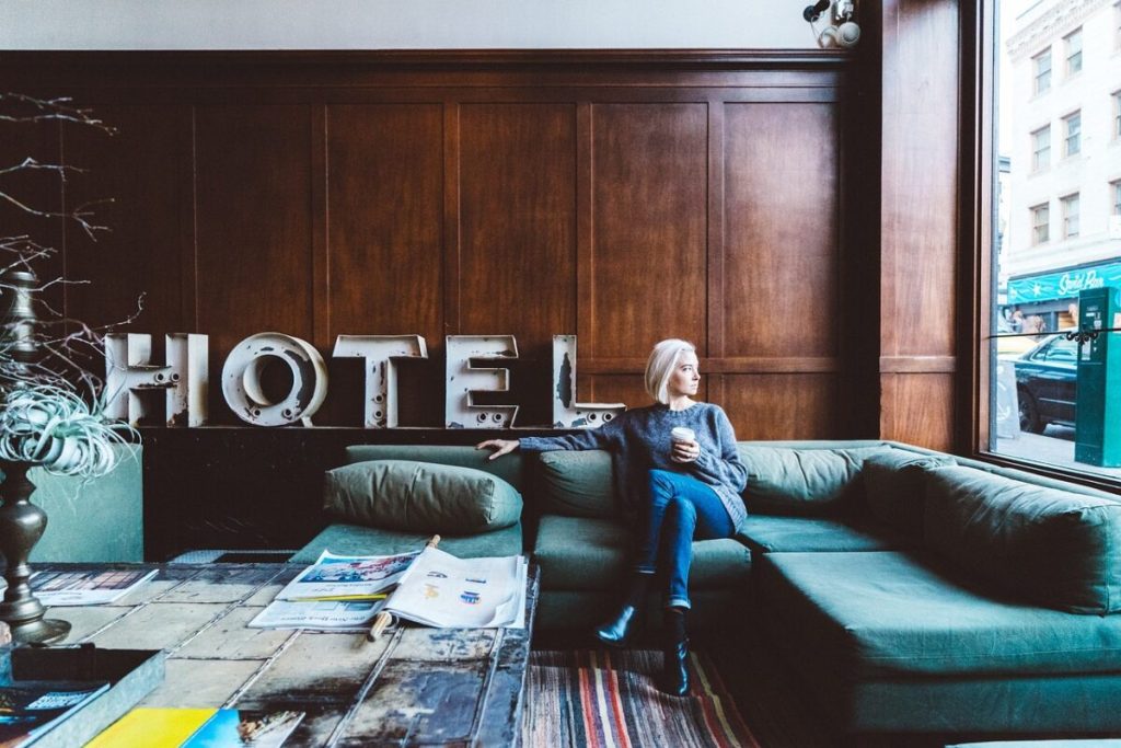 Woman sitting in hotel lobby