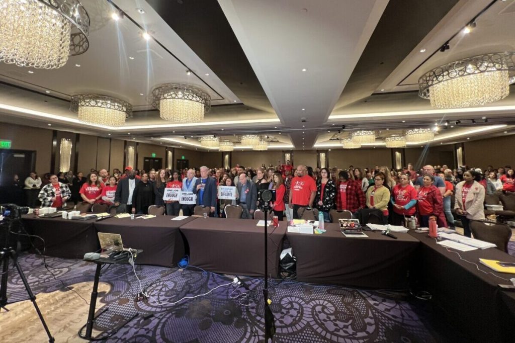 Workers and union representatives gathered in conference room