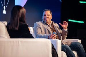 Cvent CEO Reggie Aggarwal on stage at Cvent Connect Europe 2023 in conversation with Claudia Winkleman