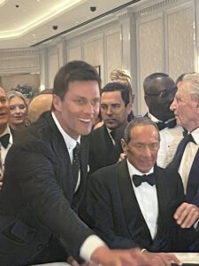 Tom Brady and Paul Anka at a gaming table at the opening of the Fontainebleau Las Vegas