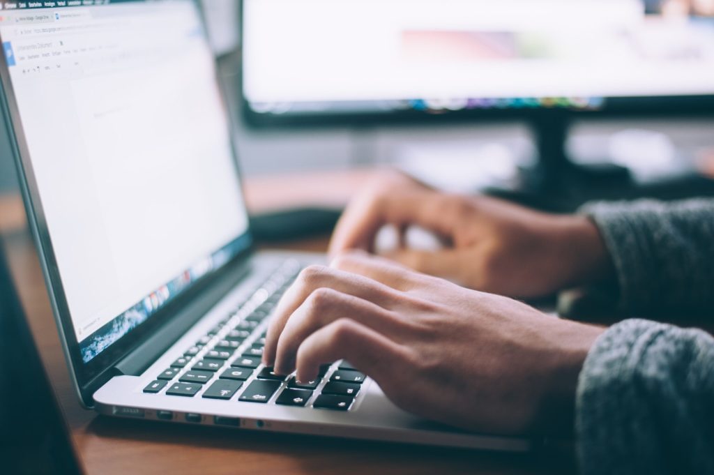 Image of person working on a computer.