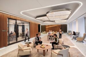 Lobby of modern office space with people talking and eating