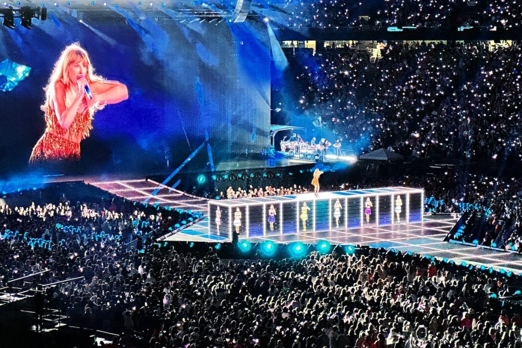 Taylor Swift performing on stage at Gillette Stadium