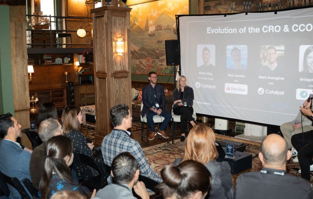 People sitting in an upscale room for a meeting