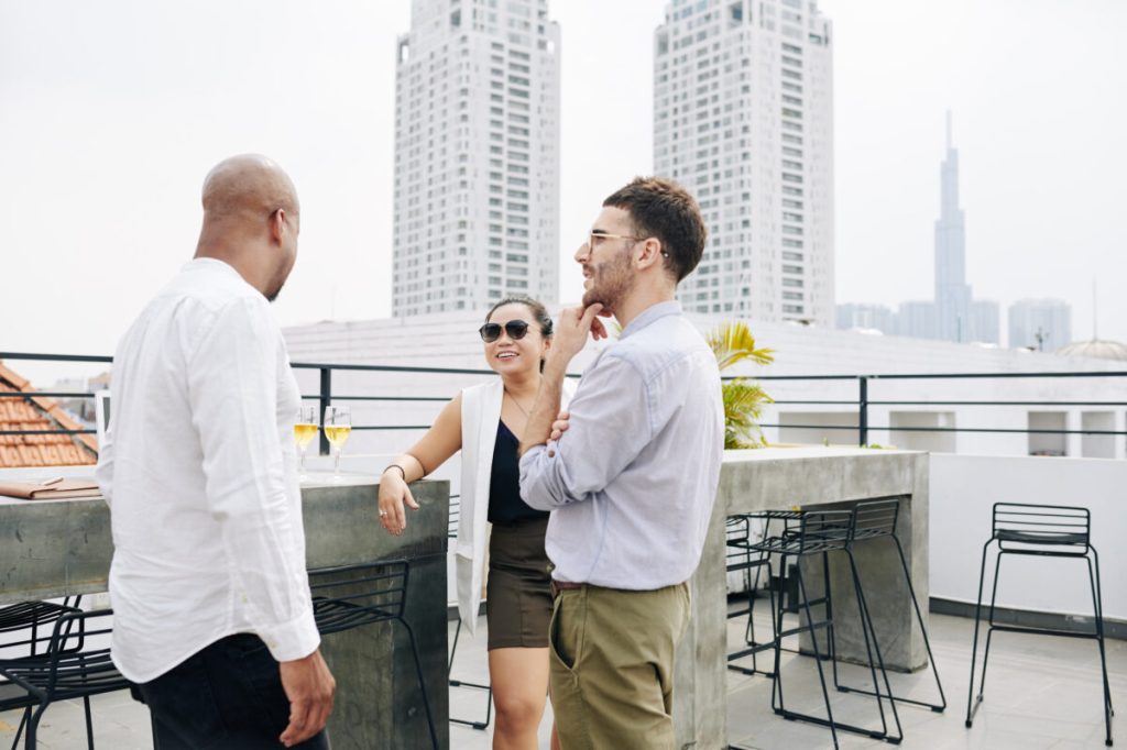 Coworkers gathered on a rooftop beating the heat