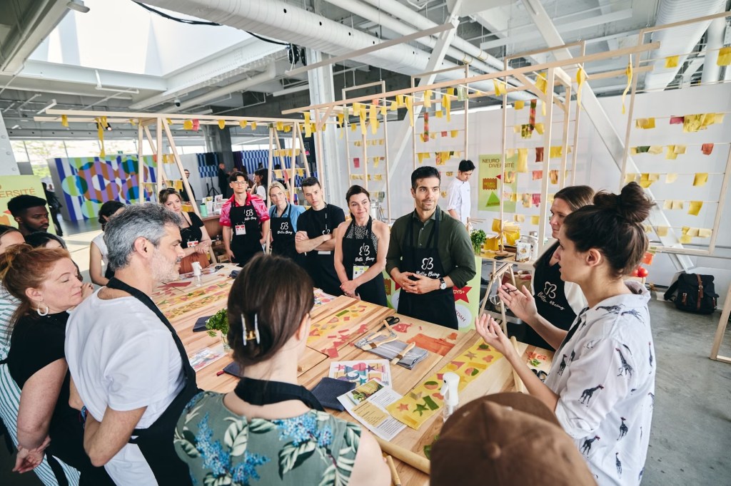 group of people gathered around a table during a conference