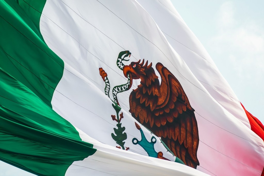 Detail of a large mexican flag flapping in the wind