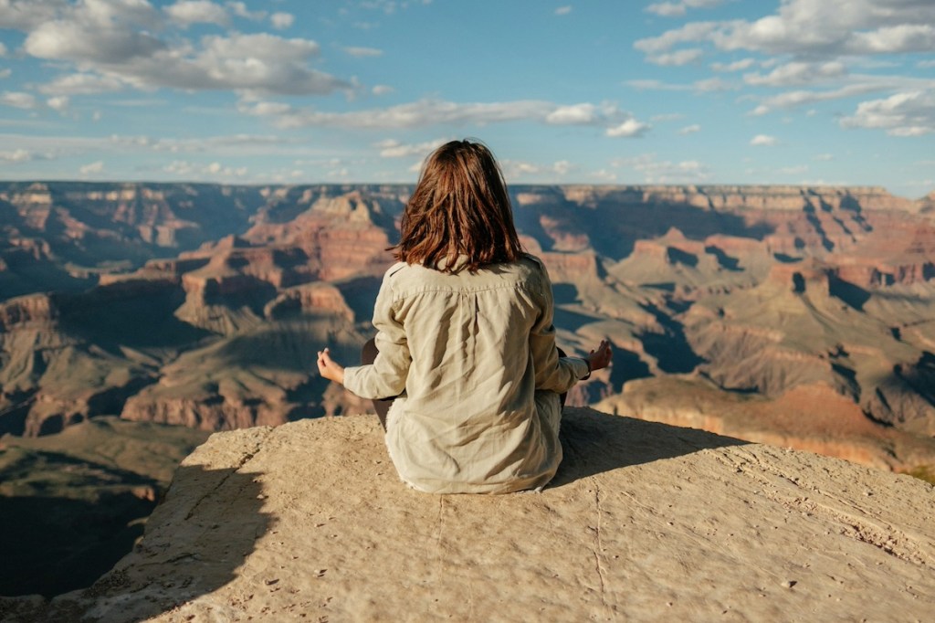 Woman overlooking a large canyon