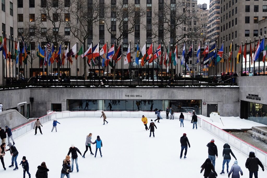 Group of ice skaters on a pop-up ice rink in a city