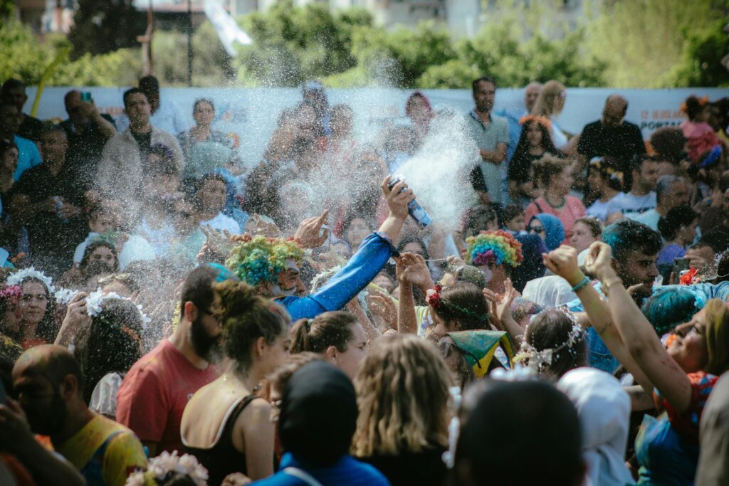 people spraying foam for entertainment at an event