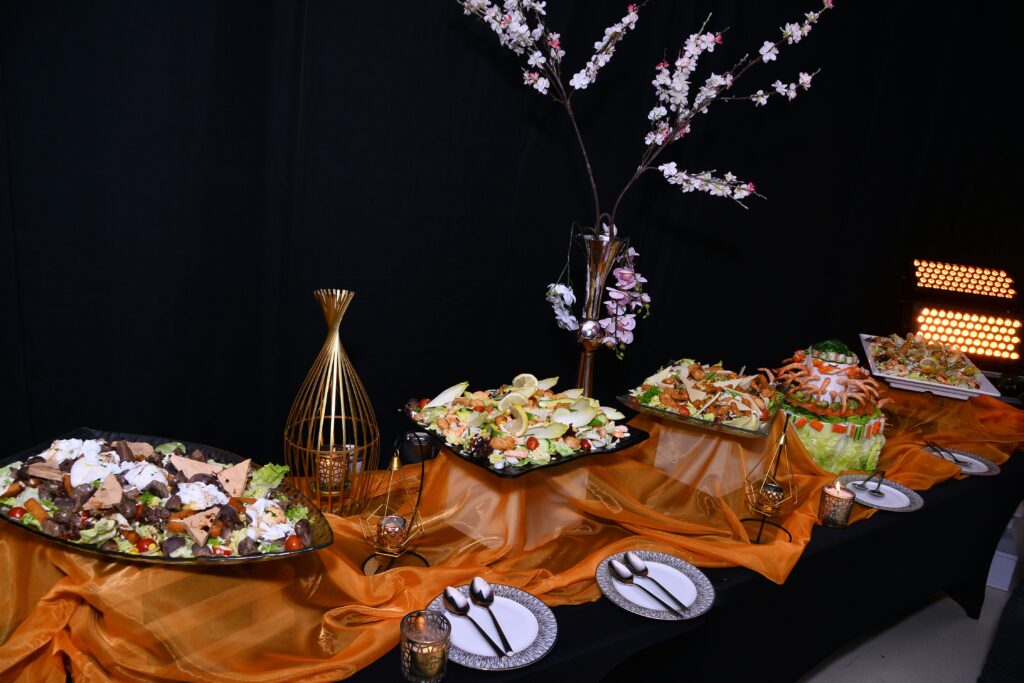 Buffet table with various foods at the event