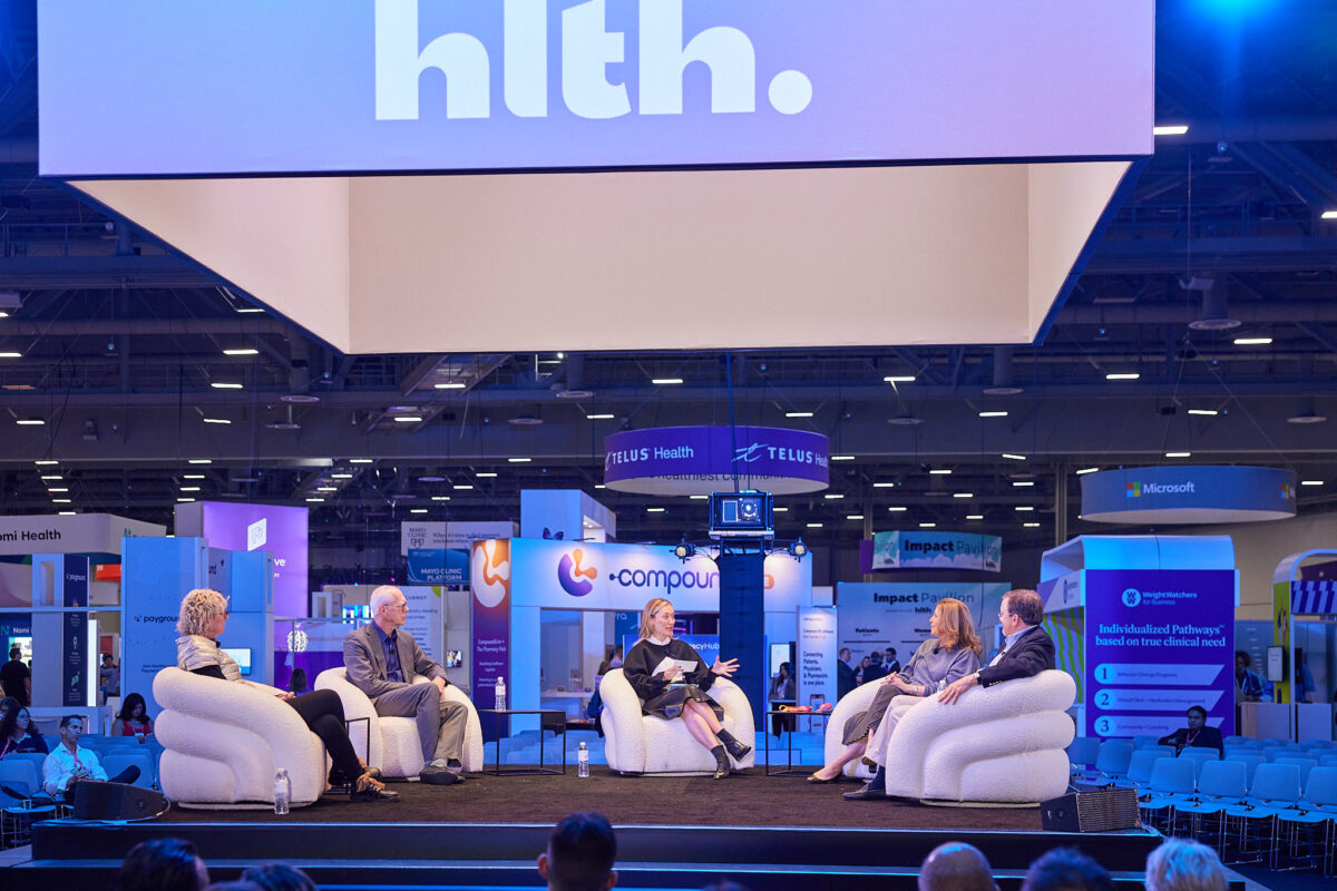 People sitting on chairs during a conference