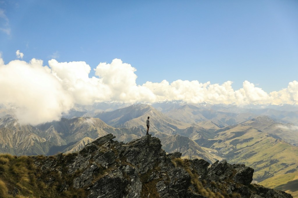 A person standing on top of a mountain