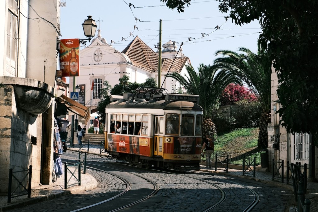 Classic tram on the cobbled streets of Lisbon