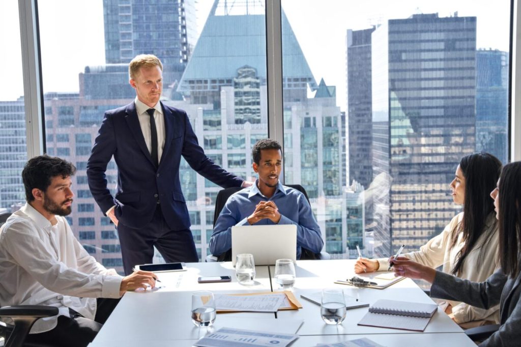 Deal making around a conference table in a skyscraper