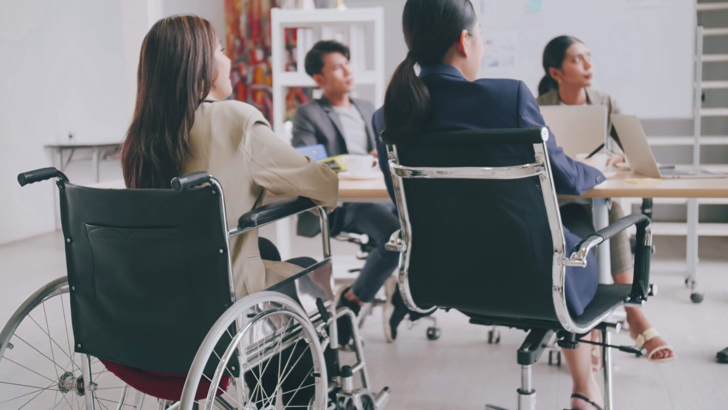 Someone in a wheelchair in a business meeting