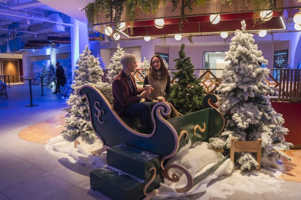 Two people in a sled.