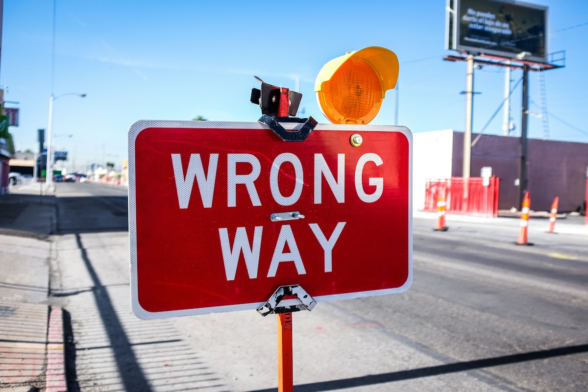 Red Wrong Way Sign on City Road