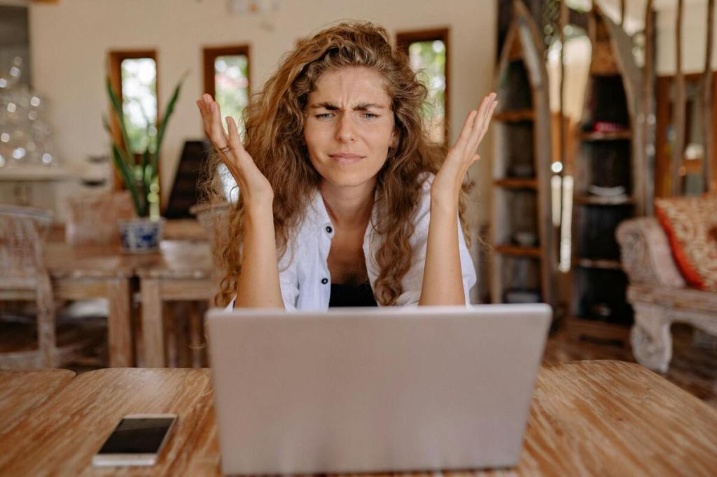 A stressed event startup founder sitting at a desk visibly frustrated by mounting business challenges