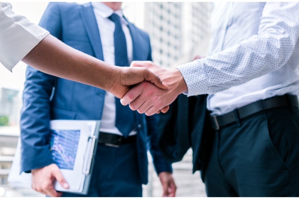 Handshake after merger.