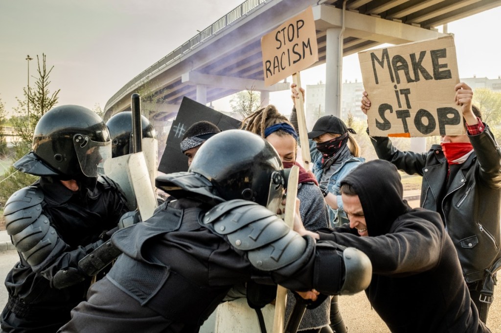 Fighting against protesters at a rally.
