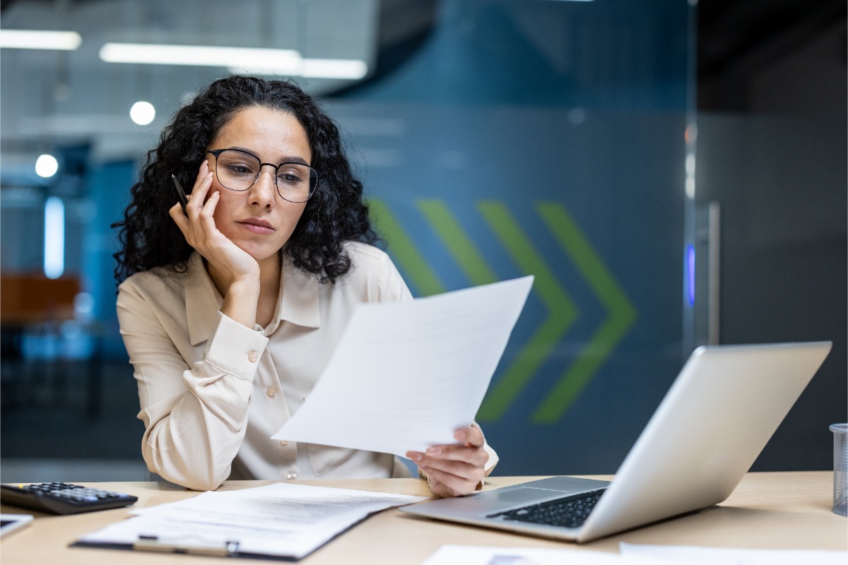 business person looking over meeting room contract